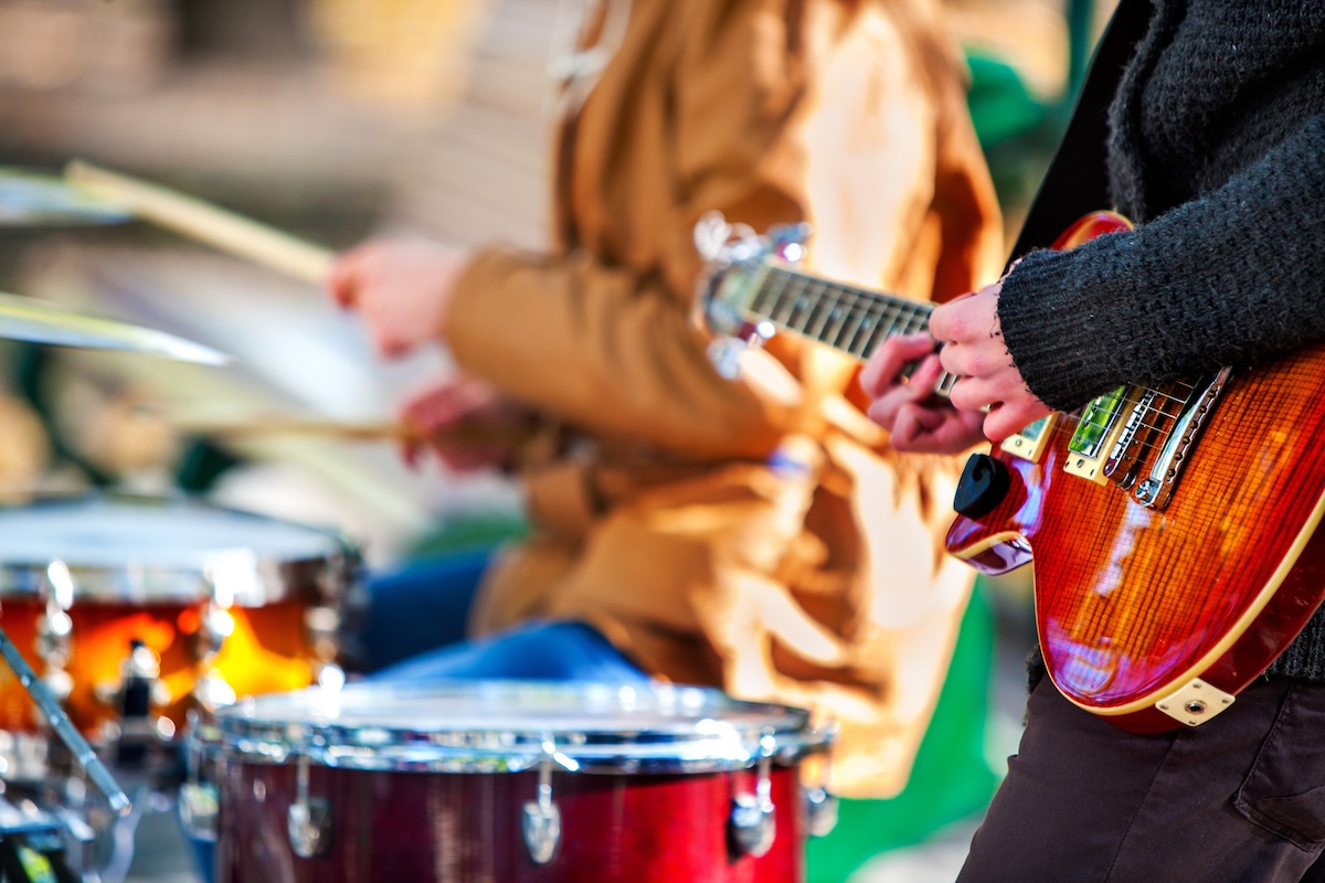 Festival music band. Hands playing on percussion instruments in city park . Drums with sticks closeup. Body part of male musicians. Sharpen is guitar and man hand. SSUCv3H4sIAAAAAAAEAH1TwY7bIBC9V+o/RJxDFwwB05/o3qs9jGGcoNghMnhXq1X+vdiOtySKcrGYN7w3b/DM188fmw1pIHpLfm++pijHvuvGmAZIPpwyzLZXHJ1PYfDQTeCEXeYMiQnSGDEWEvEwpoRDTMEeM8xNcd1Cwn3WuSGsHv4u8WZNzMnMyCnyiuHcIdkWmTg2U4as0GX7jA/DMb78GZMLYXgusxze1s5hjyf7+d9uhtqQQuehtJxRzmStfnG2k3z+1t+Sb9/1iBsQ+ph8j/dsYW5s8R2/iXX1UA7PIfp0PmRH8U7xhl6xR/Qu/4o7lrjzIdhDJnTQfz4rKKxSdQ0NbbW1VNqW0VoppIbznMGKNW0hvBwuxaQM2CEsg3WtQRwHrbHdUaGYppIxRxvhWlqD4kxXwBrQqweirVQ7VRlaS2mobFqdL2ukcue4zE1ipcVcf2mKHD/yzPbzWF4dvHuHoYhhdD4UY/seLHQTQRS2z4O3/rQvaCEdcChim/cr9AVwCmlu8/p+xOUdmUIuuKiYEcyY/GhM5AlYdy5vlnelV+8mhhQSLVOKOmsUlVALCpw3VCMYg87VUunc8+UfO9xvxfsDAAA=